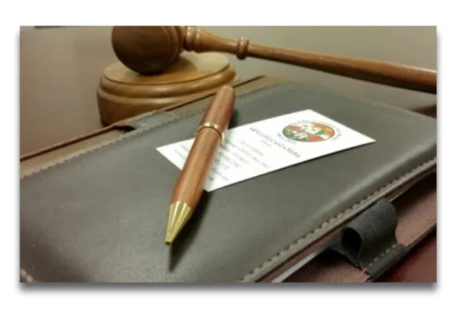 Office of the Mayor banner Pen on top of an agenda book